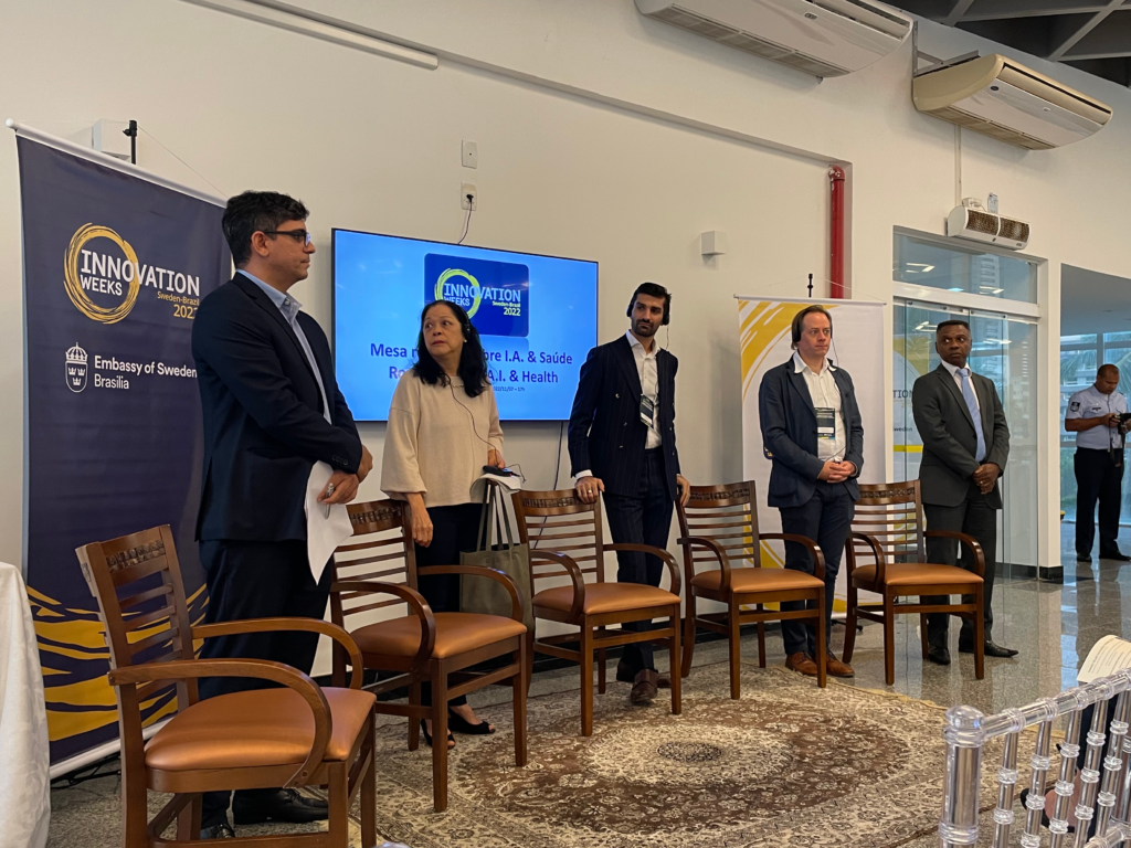 5 people in a panel discussion standing in a row